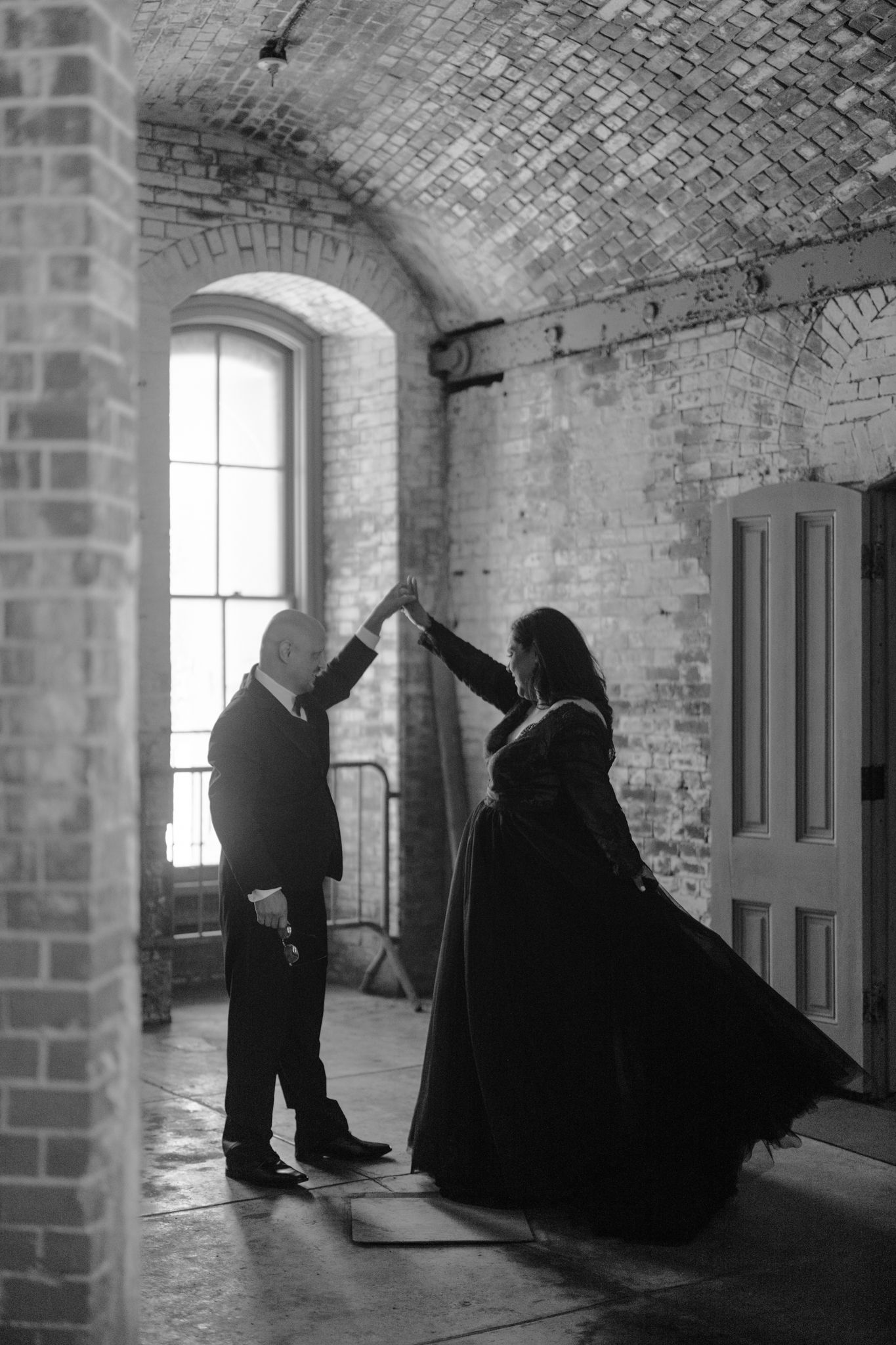 black and white photo of a couple dancing during their anniversary photoshoot in San Francisco