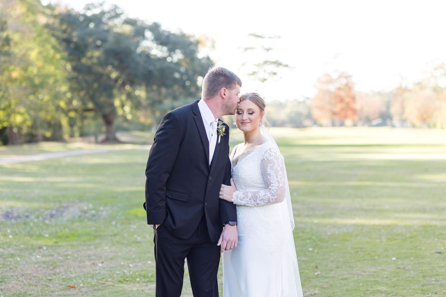 bride and groom kiss