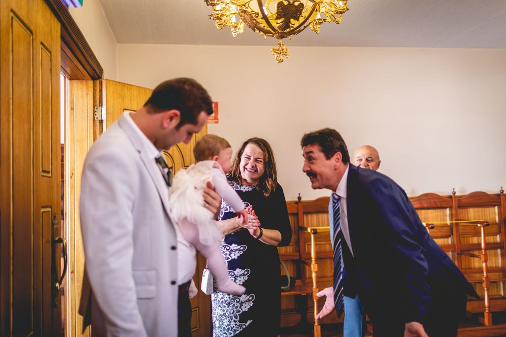 Candid moment of celebration and laughter in a church gathering space.