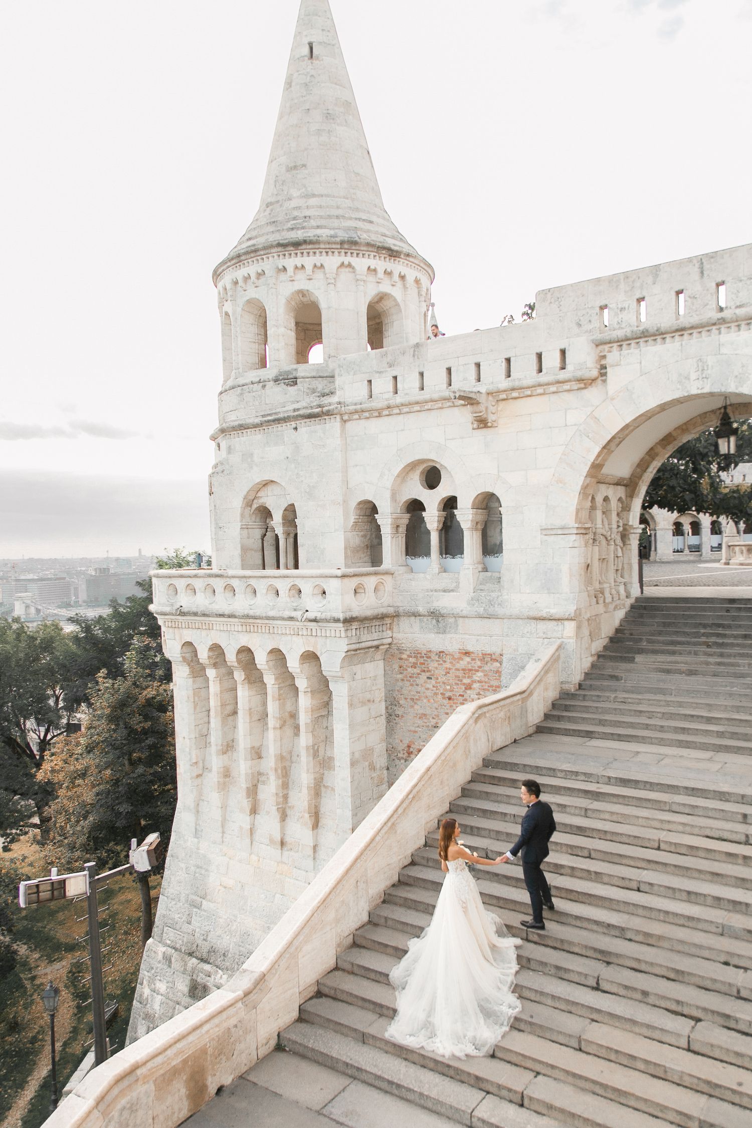 bride-and-groom-with-budapest-city-view-at-fishermans-bastion-destination-wedding-photo.jpg