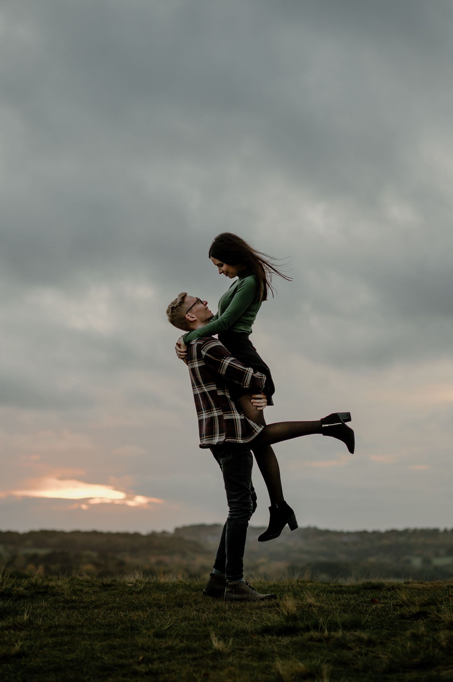 A romantic lift silhouetted against a dramatic sunset sky.