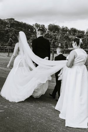 Flowing white wedding dress movement captured in a series of artistic black and white photos.