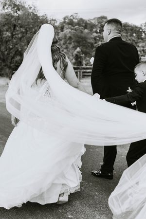 Dynamic black and white photos showing a wedding dress swirling in motion outdoors.