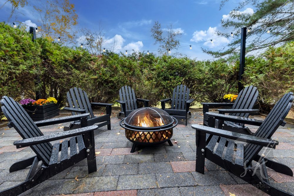 Vacation rental photo of Bolton Landing patio with Adirondack chairs and fire.