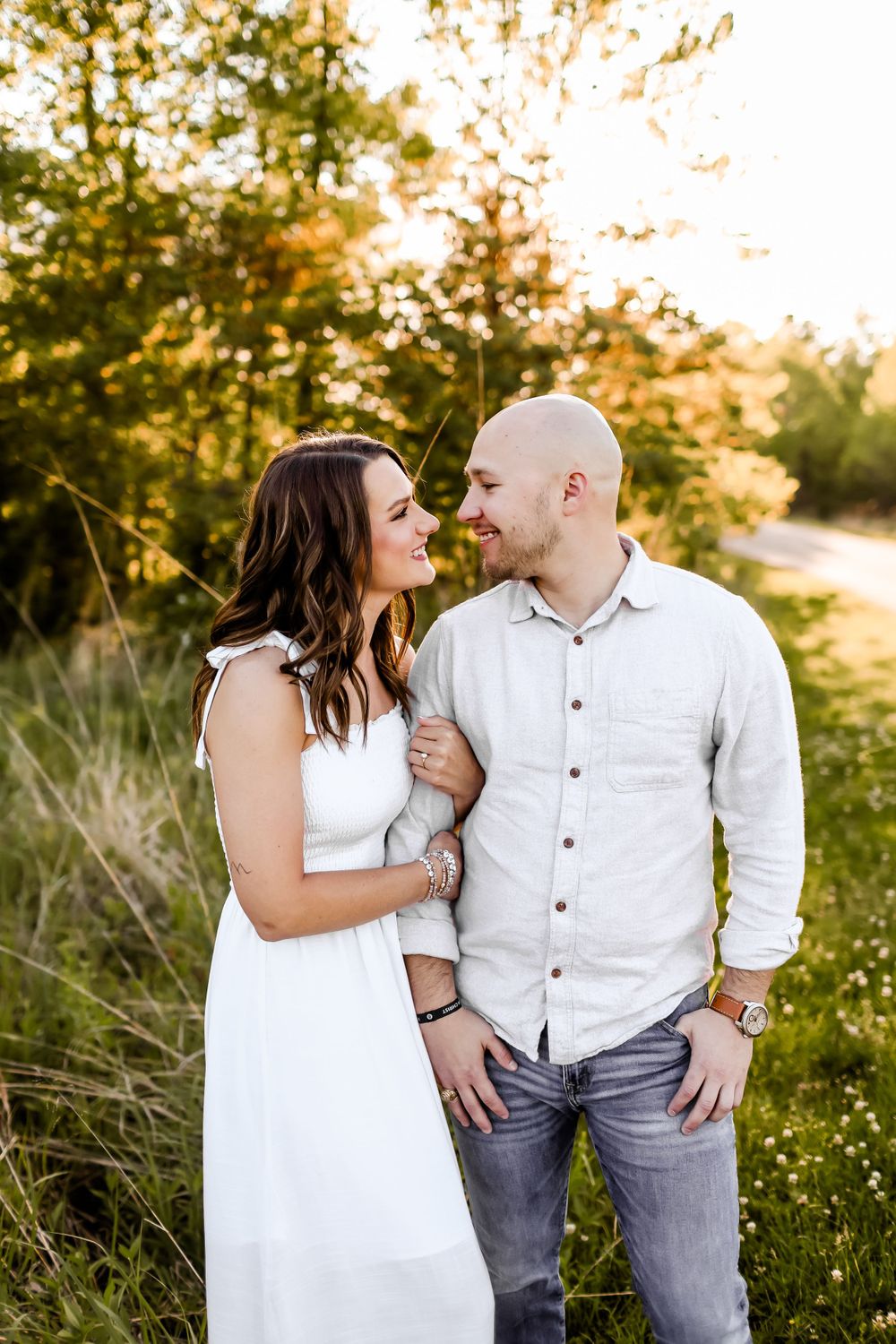 Golden hour portrait series of couple in white and denim sharing loving moments outdoors.