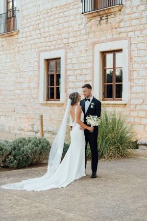 A couple standing together at a finca in Mallorca.