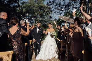 Just married and happily walking down the aisle.