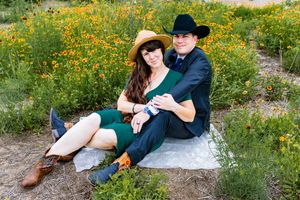 Good looking San Antonio couple posed in the Texas wildflowers.