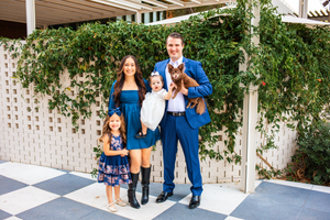 Well dressed San Antonio family posing for Christmas photos at the historical Pearl Brewery.