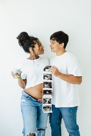 Pregnancy announcement photo shoot. In studio pregnancy announcement photo shoot in Colorado. Colorado maternity photographer