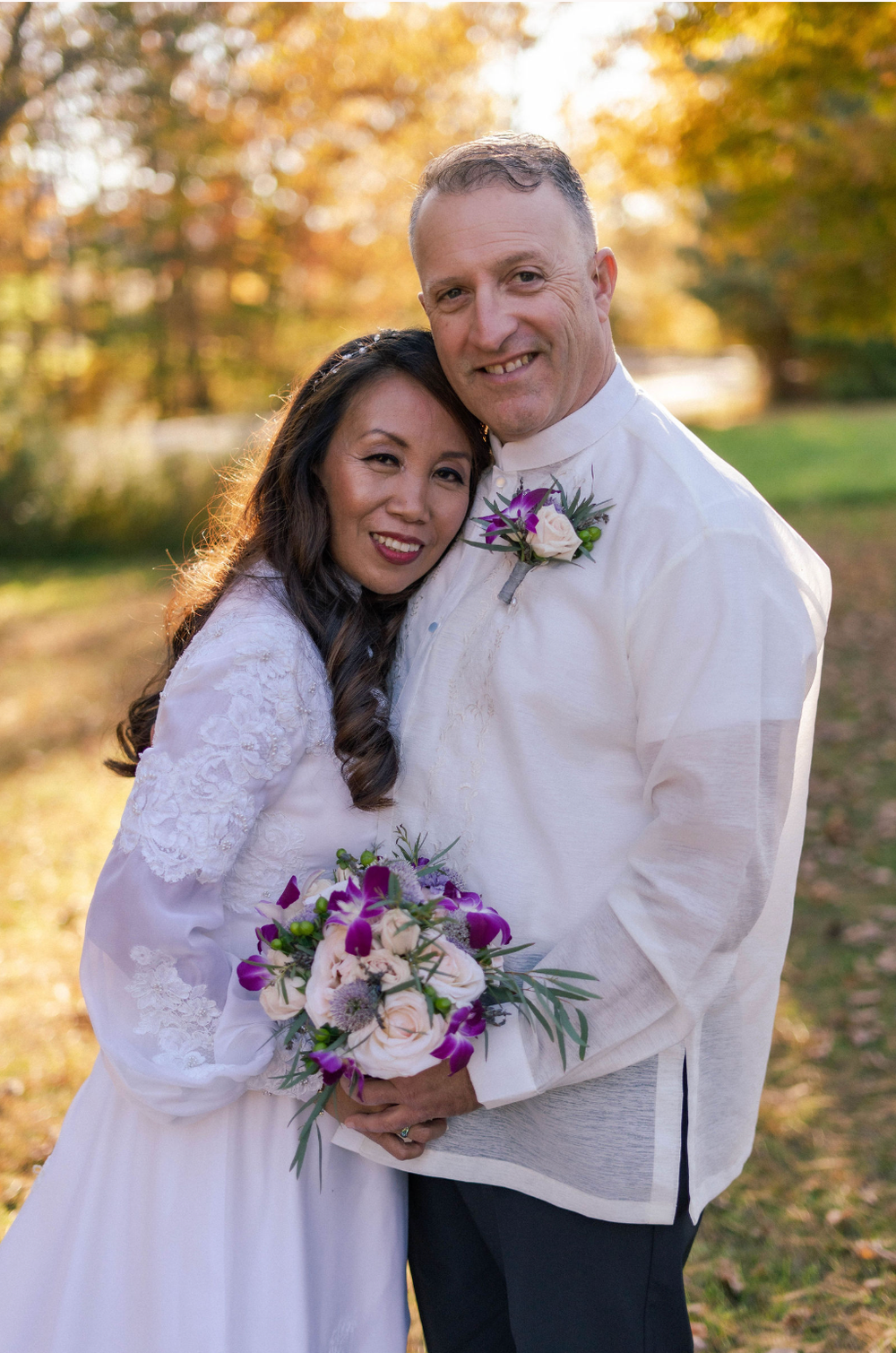Golden hour wedding portrait with bride and groom.