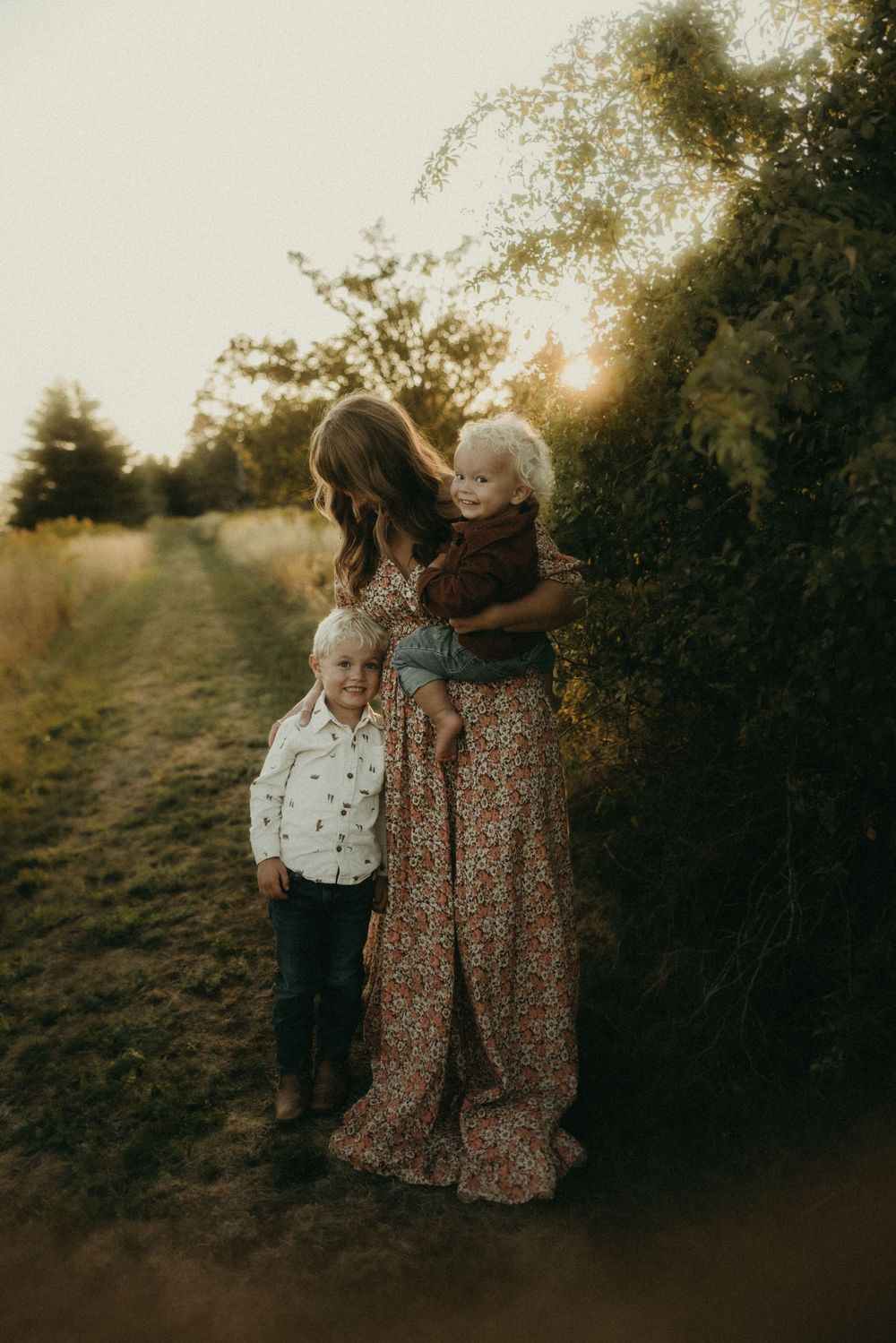 A family photoshoot capturing candid moments in golden evening light.