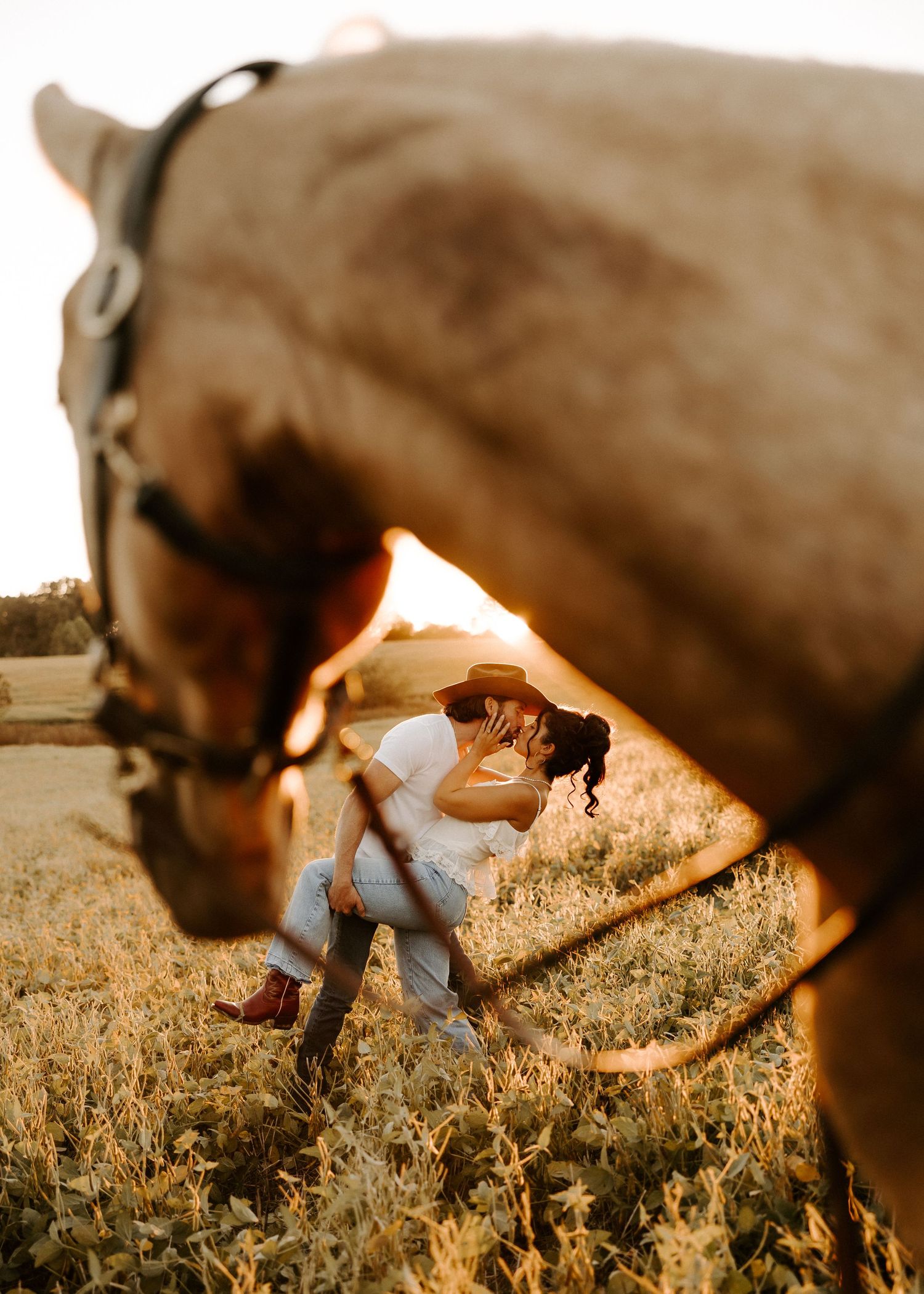 A Gallatin, TN couples photoshoot in a open field during golden hour.