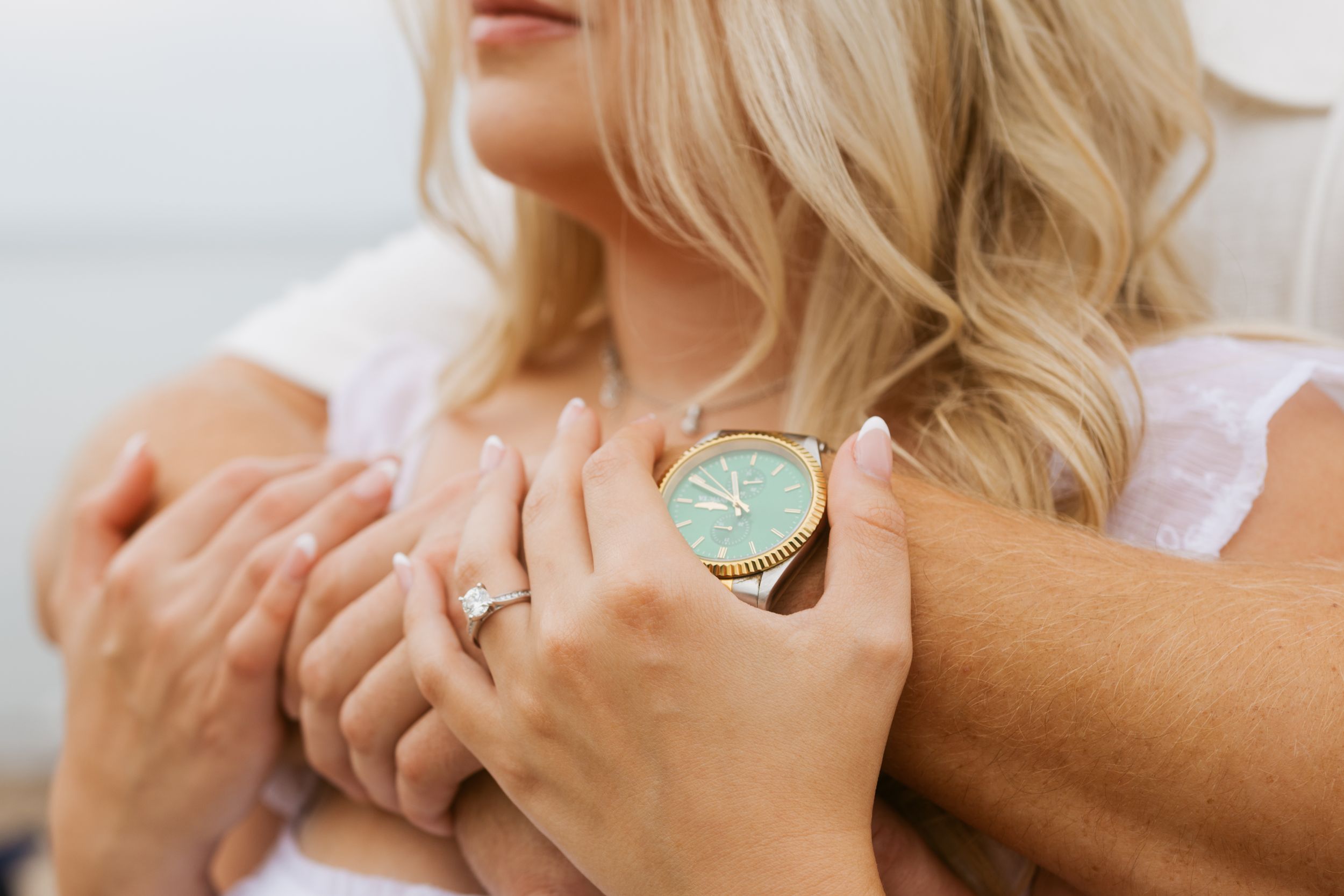 engaged couple beach close up hands holding each other