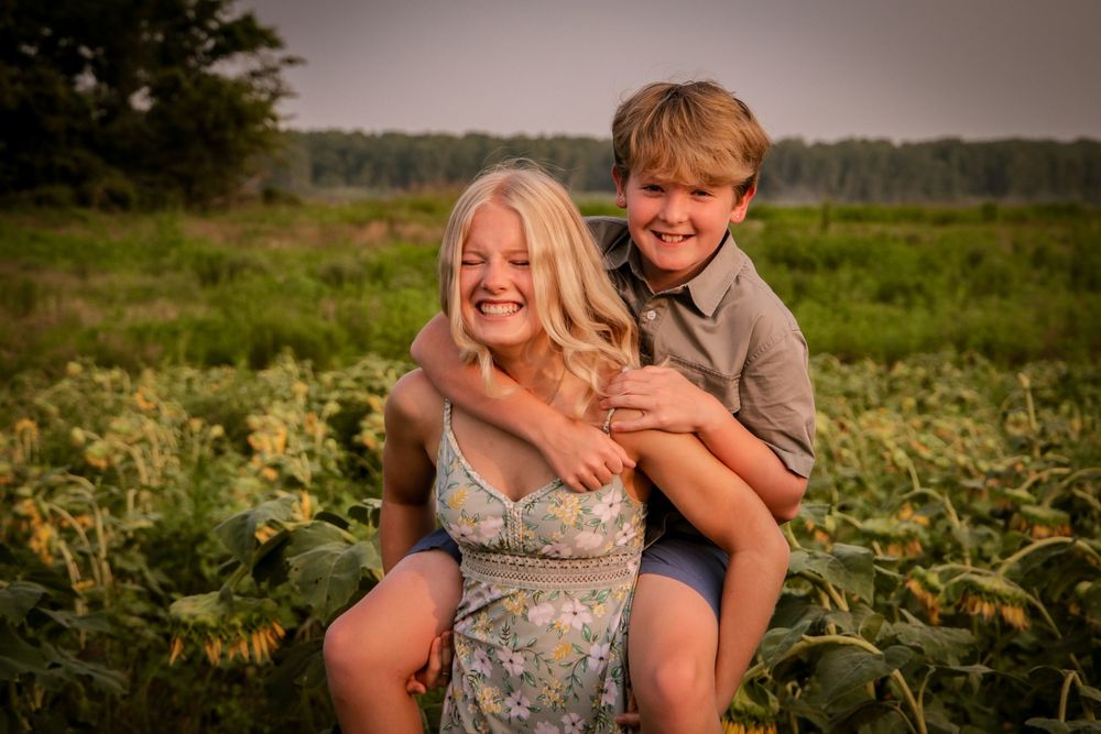 Brother and sister piggyback ride