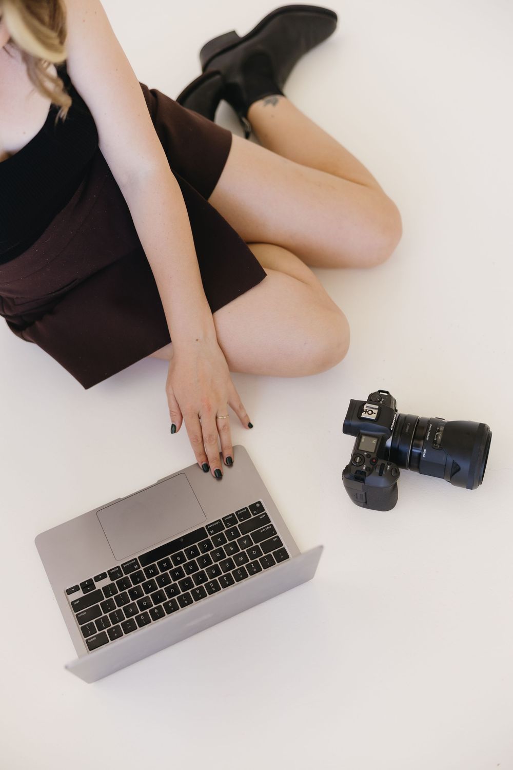 Close-up sequence showing hands typing on a silver laptop keyboard against a white background.