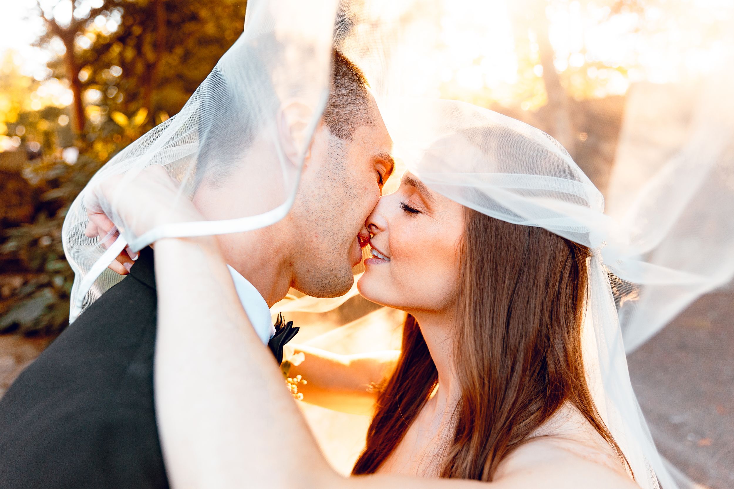 Bride and groom sharing an intimate moment at sunset at the MIT Endicott House in Dedham MA