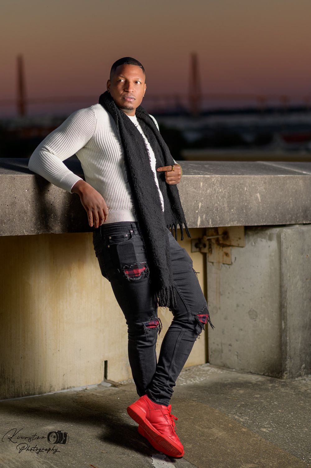 Male model rooftop photoshoot in downtown Charleston, SC. Captivating urban shots showcasing stunning city views and stylish poses.