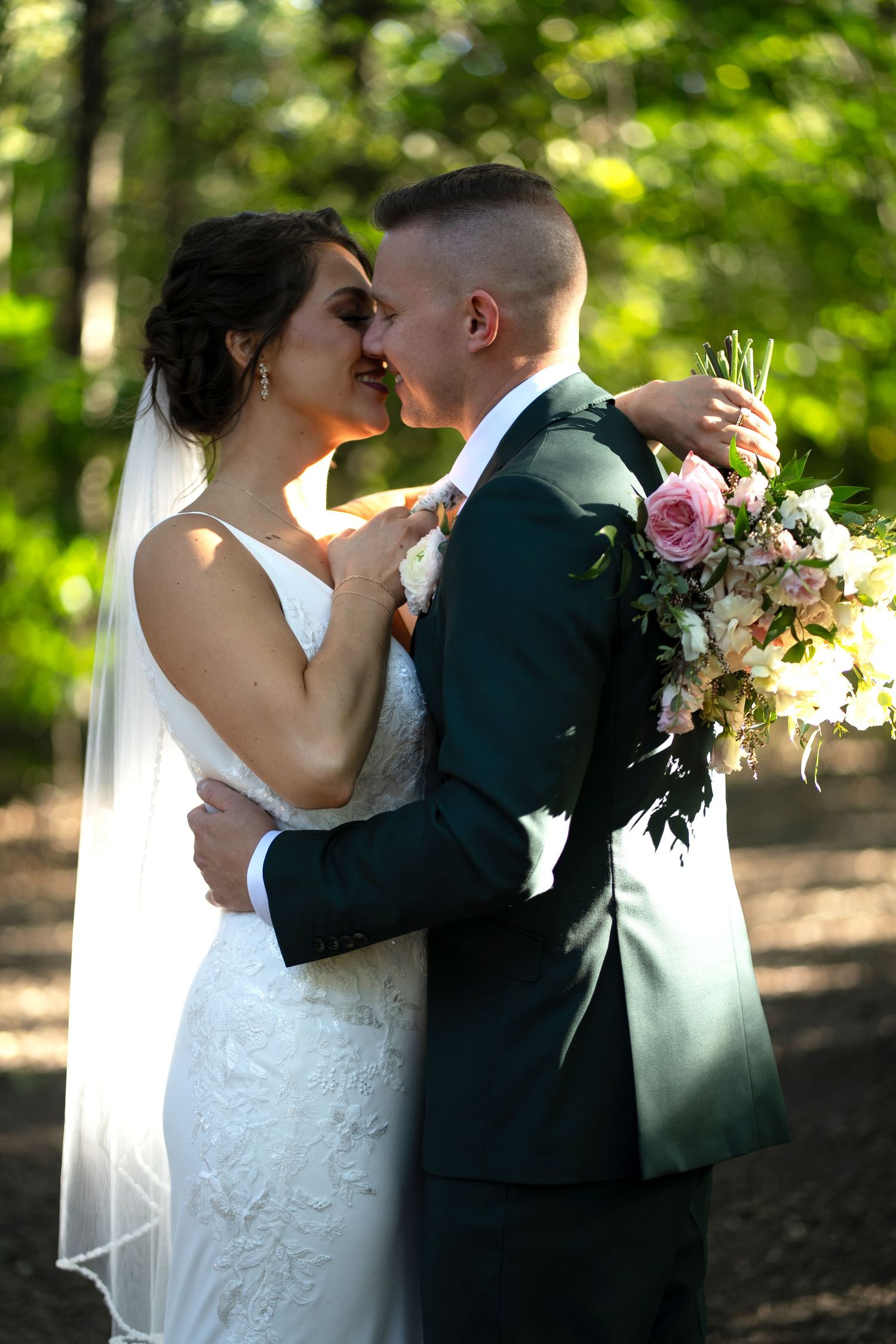 A romantic wedding photoshoot sequence in a wooded setting with soft natural lighting.