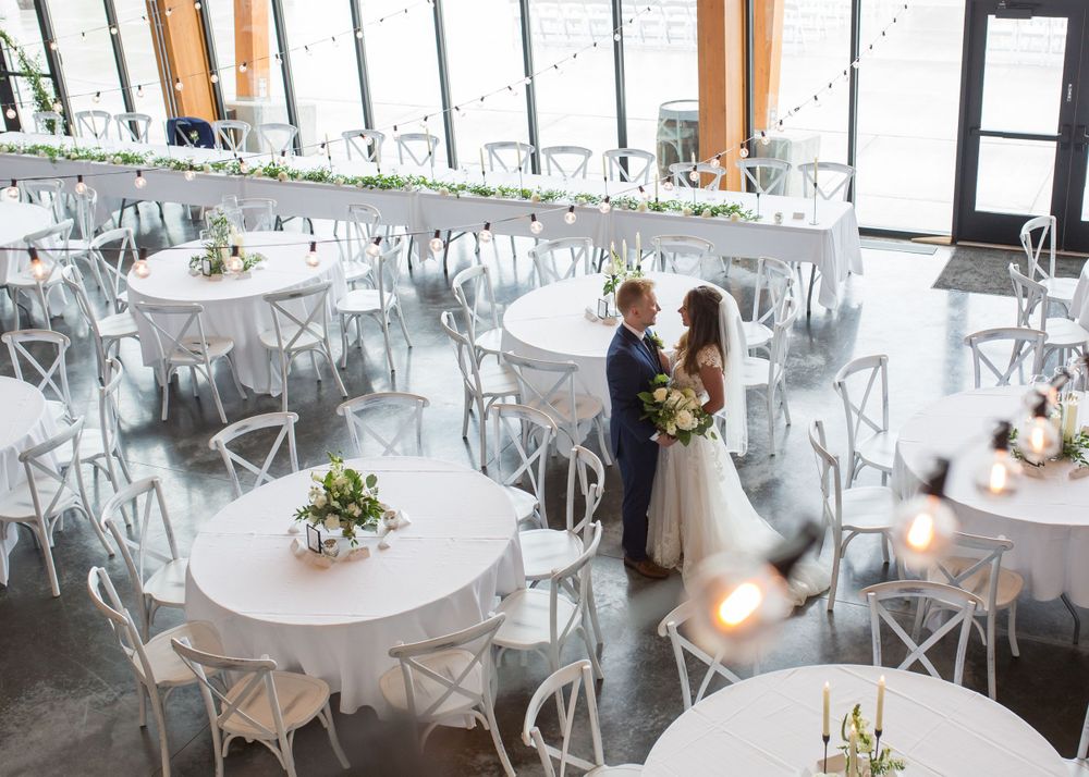 Elegant wedding reception details at Appleton WI venue, showcasing the floral arrangements, cake, and decor with vibrant colors and timeless
