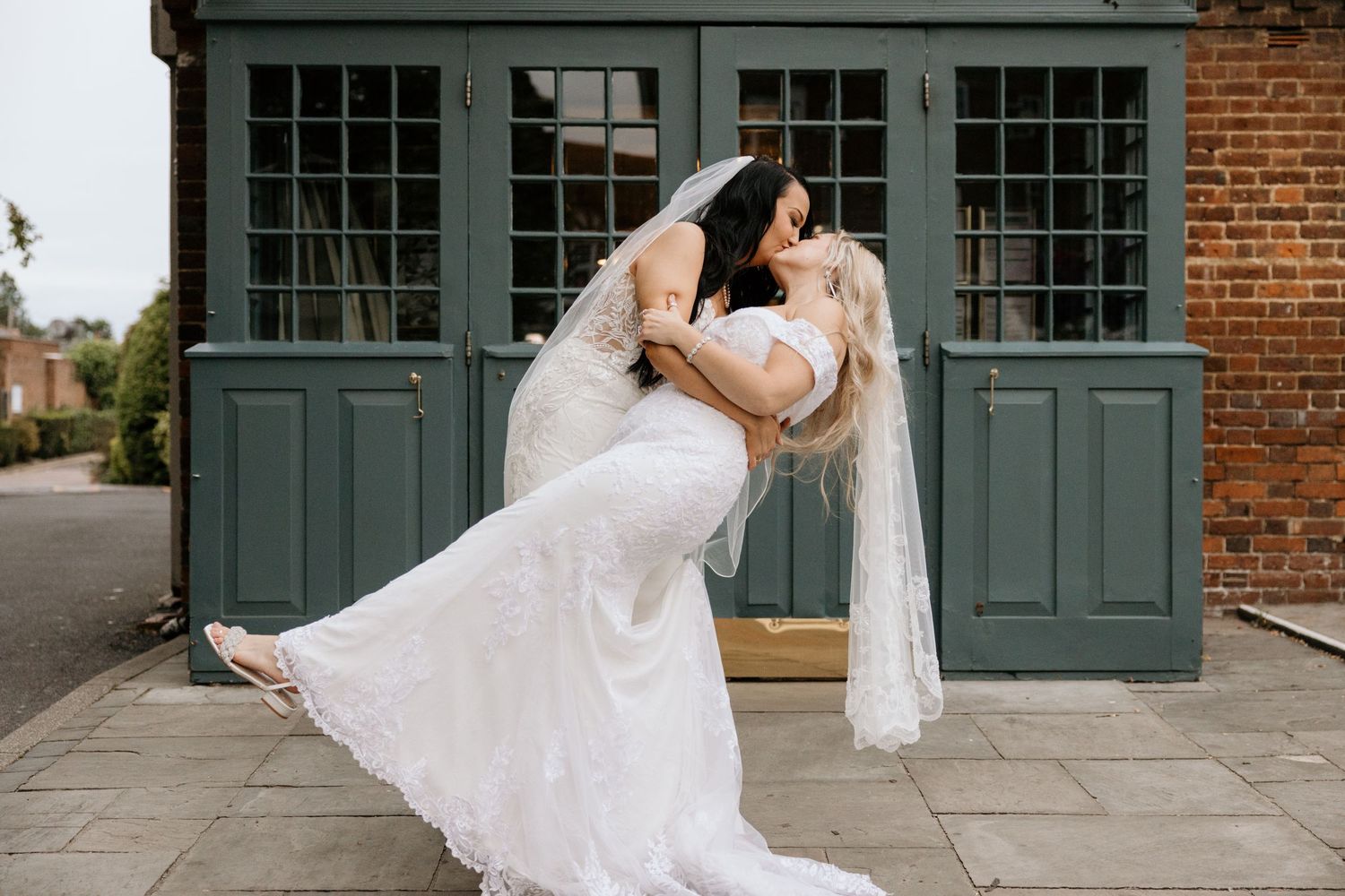 couple sitting together on a bench for there wedding day
