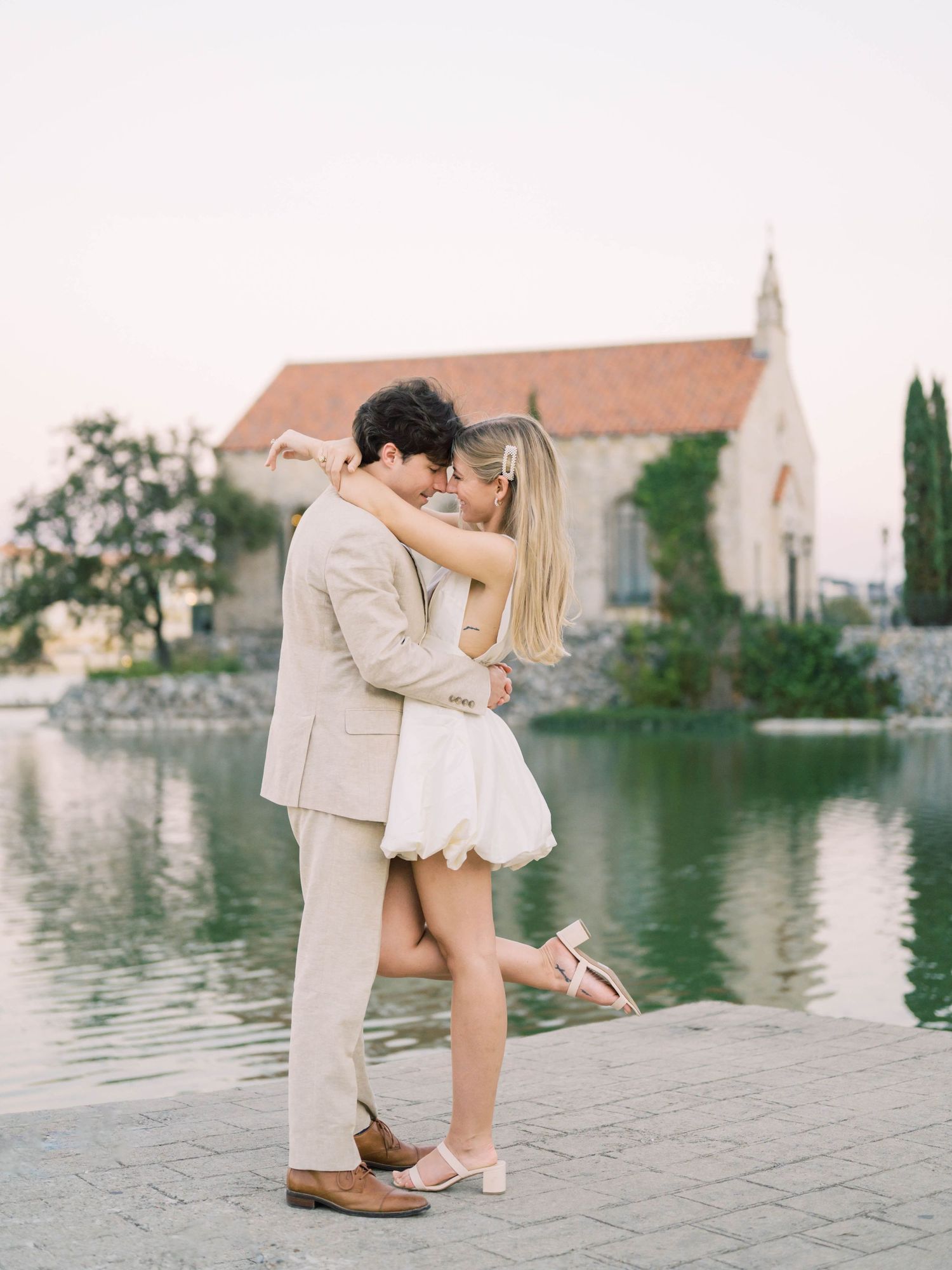 engagement session of a couple leaned in together