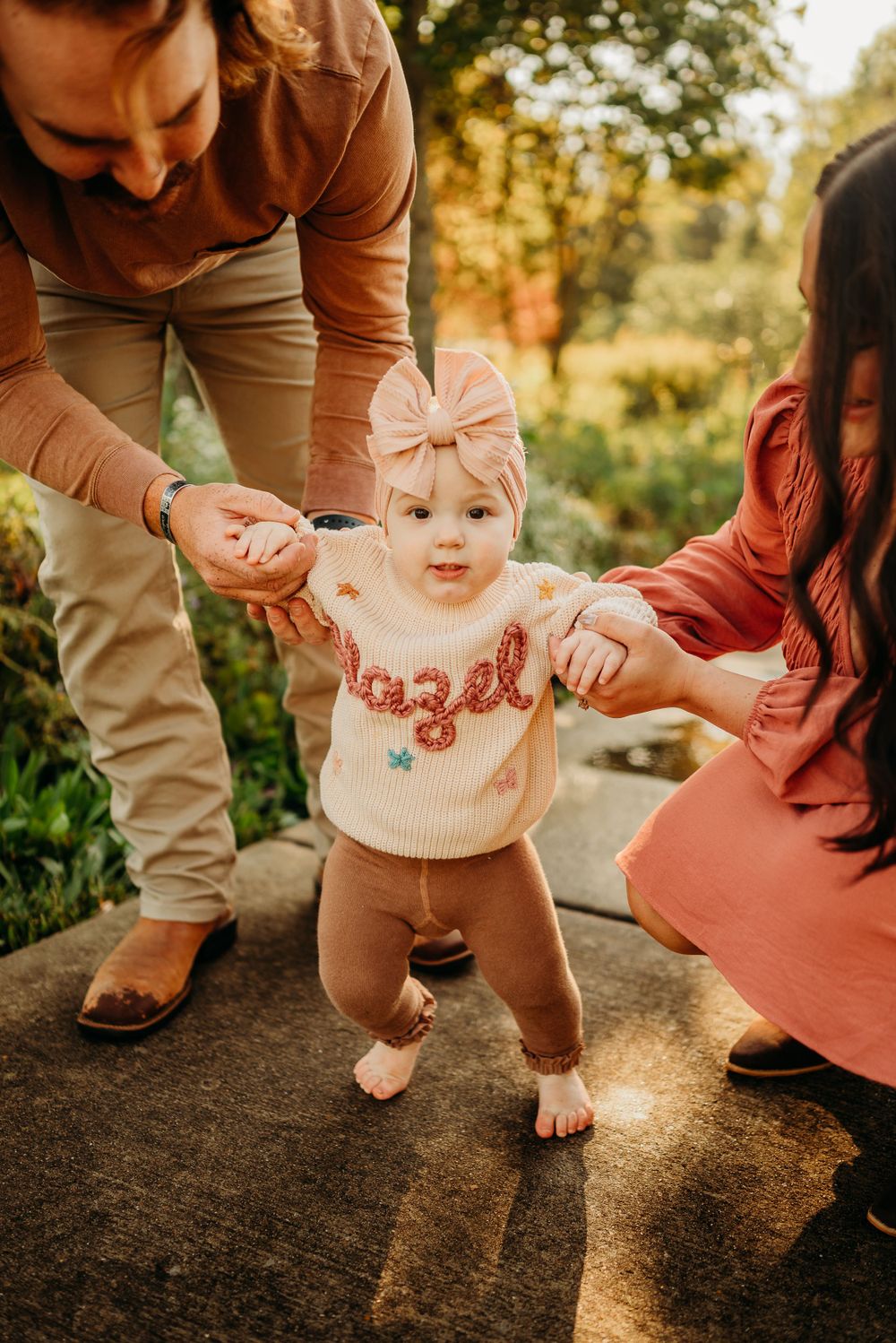 Baby girl in cute chunky knit sweater and bow. Photo by Disney Magic Photography Clarksville, TN.