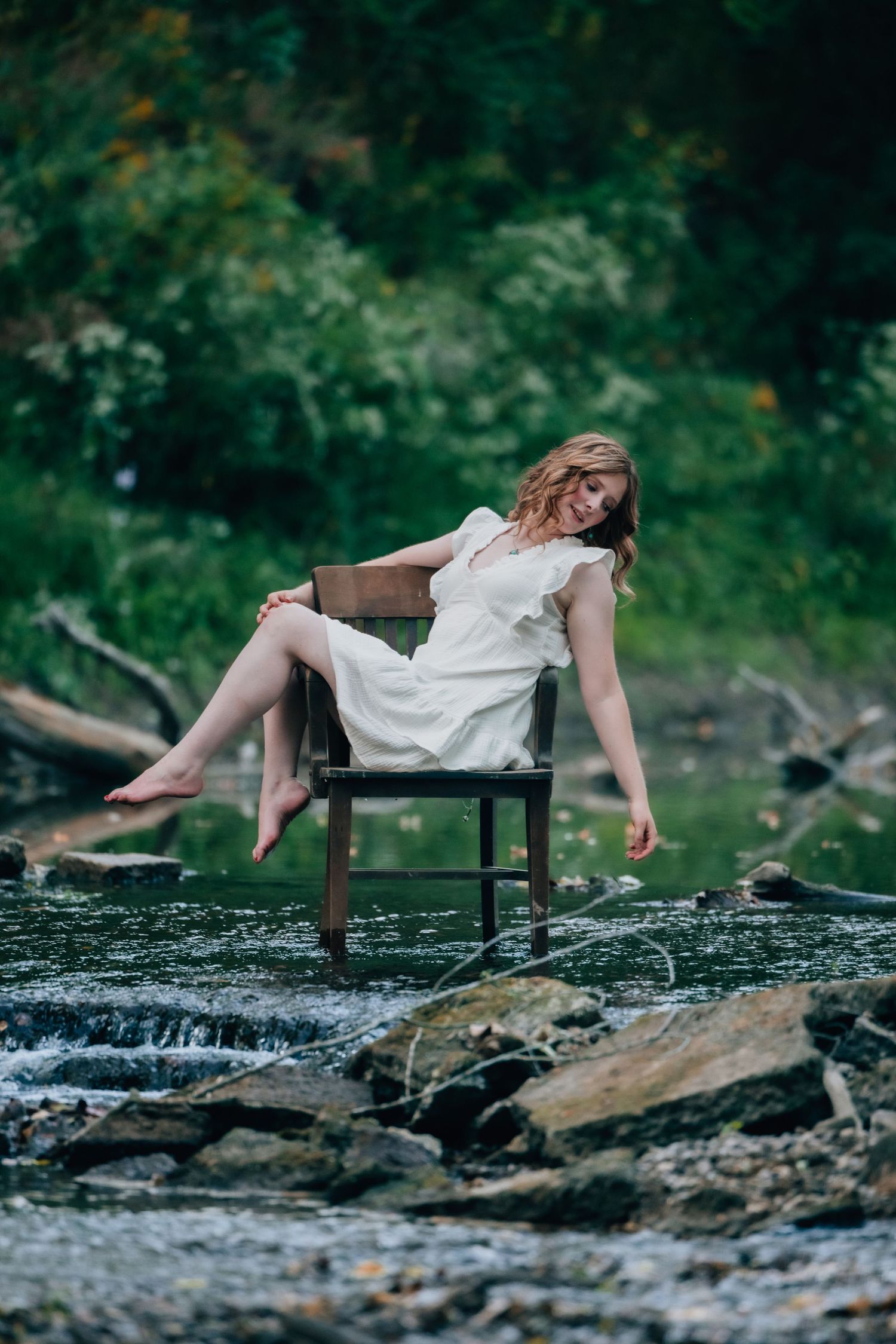 Senior sitting in a chair in the water