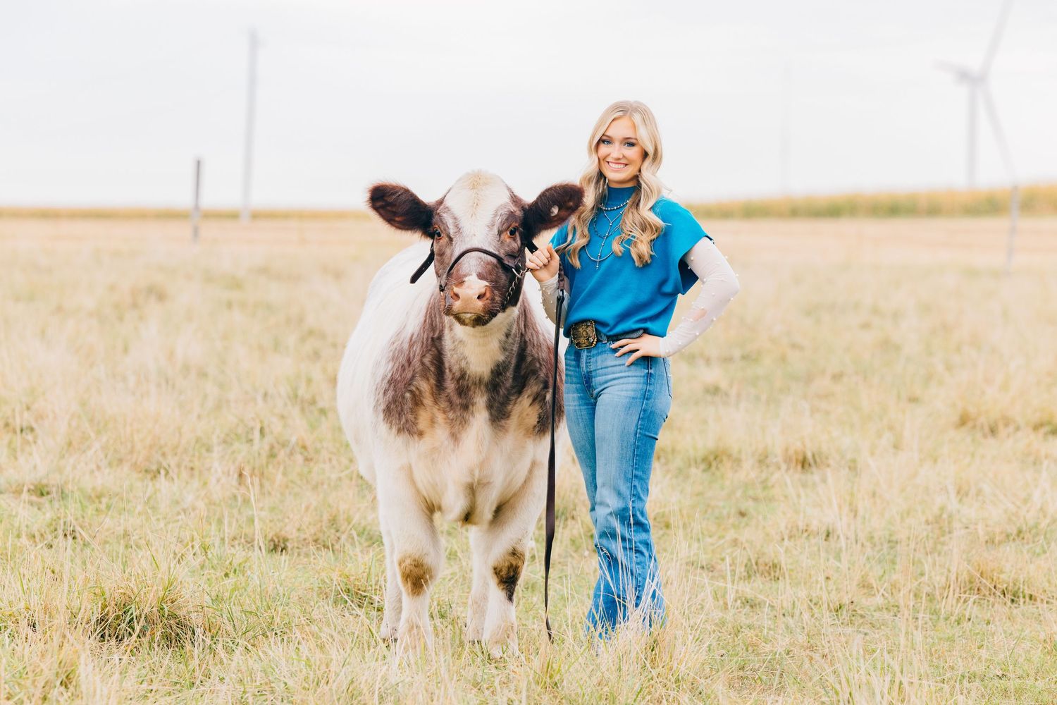 Senior posing with her show heifer