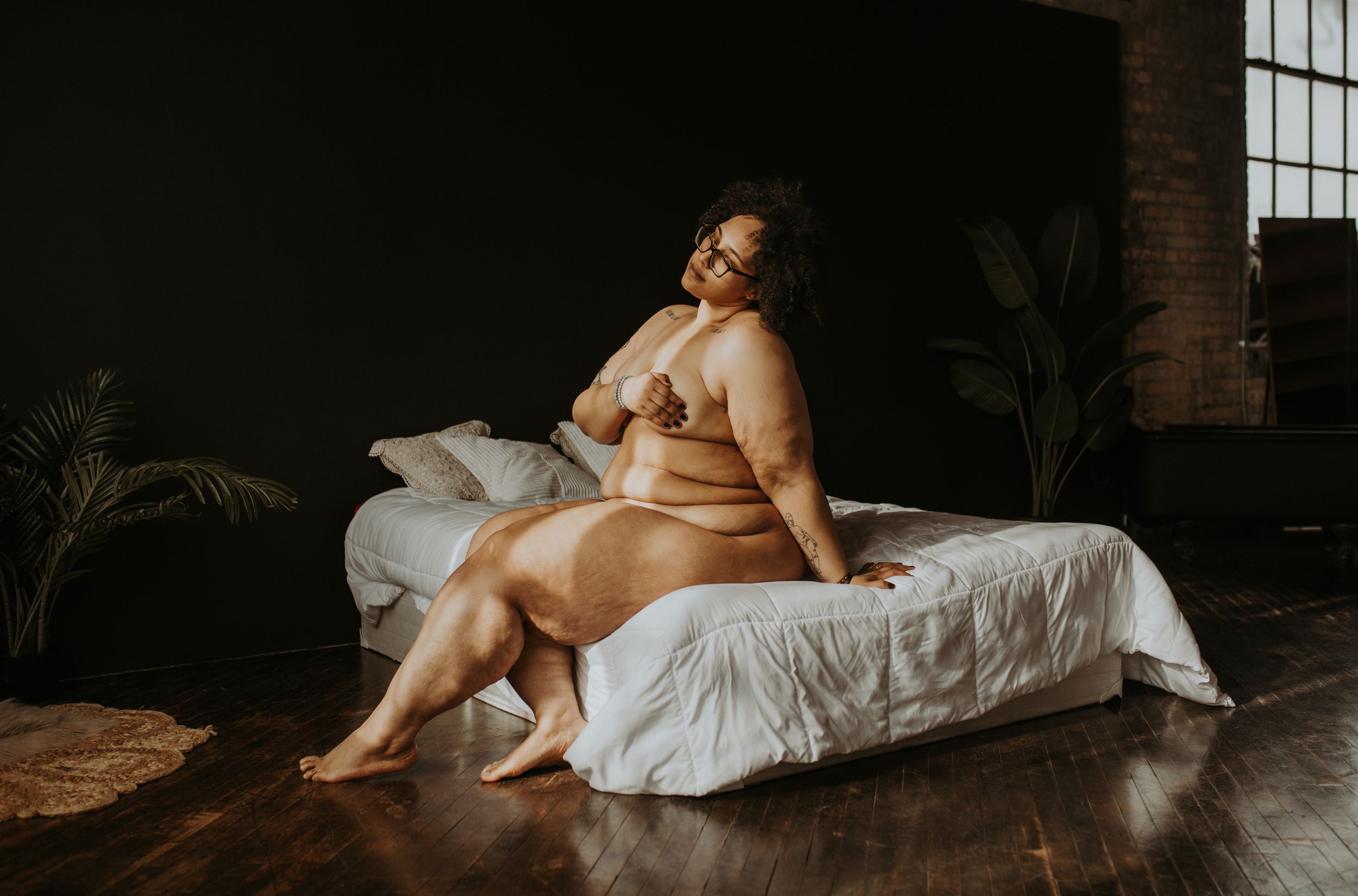 A series of dimly lit artistic boudoir photos showcasing silhouettes against window light in moody indoor settings.