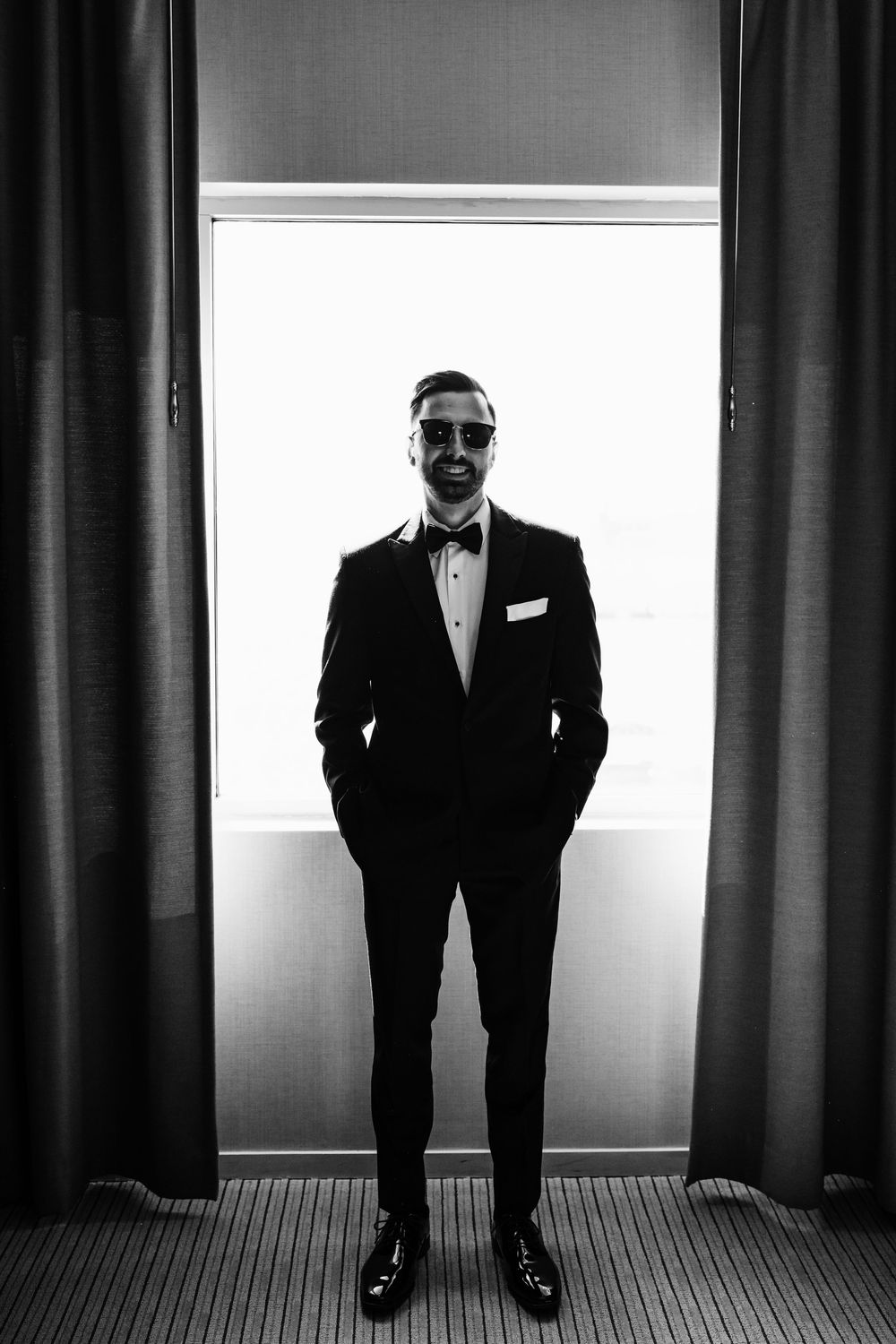 Black and white portraits showing a figure in formal attire against window lighting.