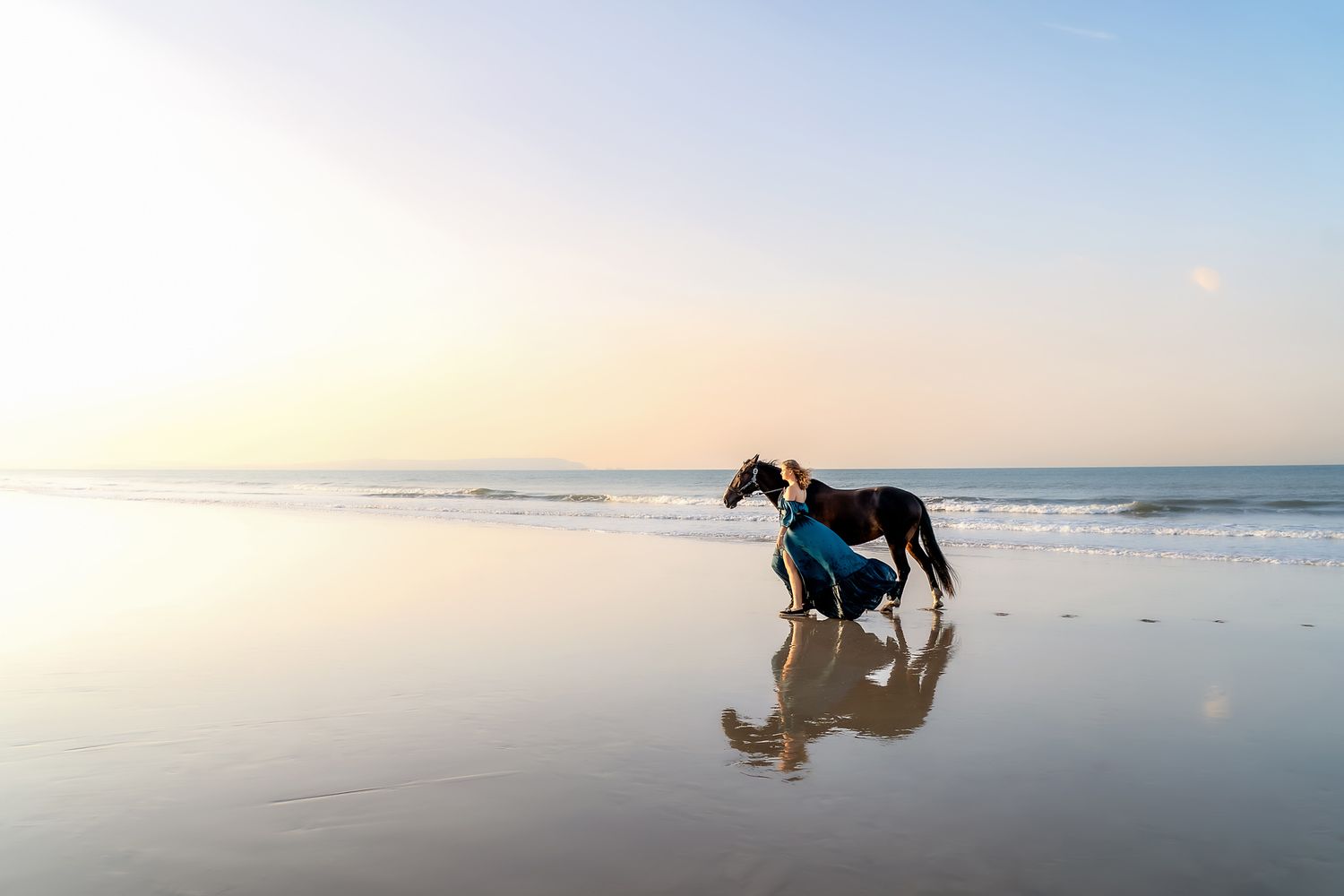 Horse and woman photo session at sunrise at Highcliffe Beach.