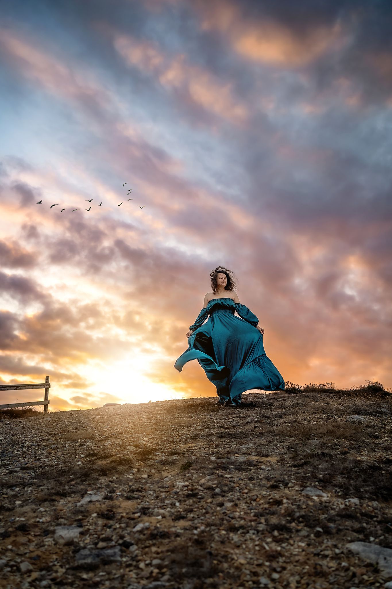 Sunrise photo session in the New Forest, a woman is wearing a green gown.
