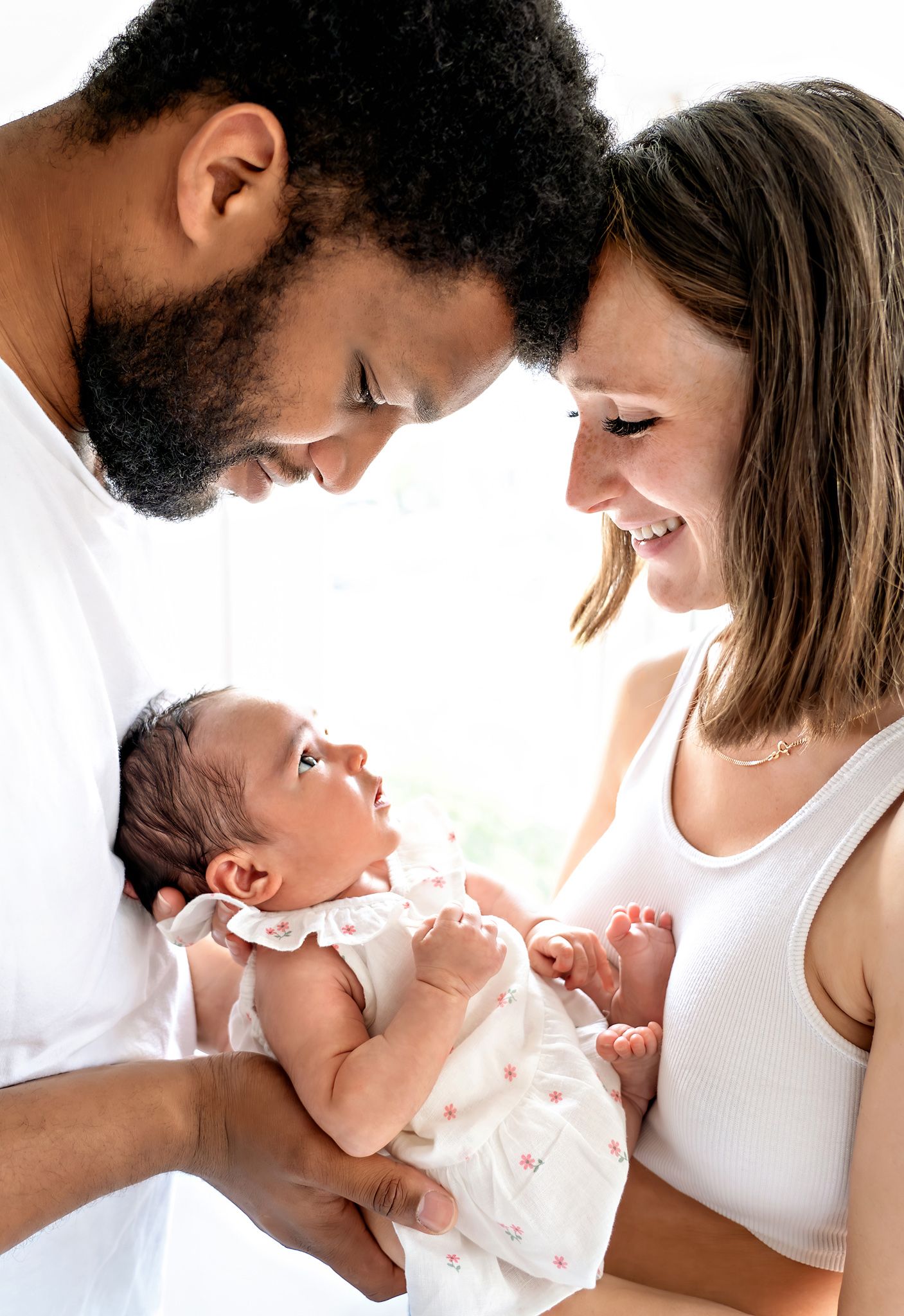 New Forest lifestyle newborn session with parents holding the baby. Location: Southampton, Hampshire.