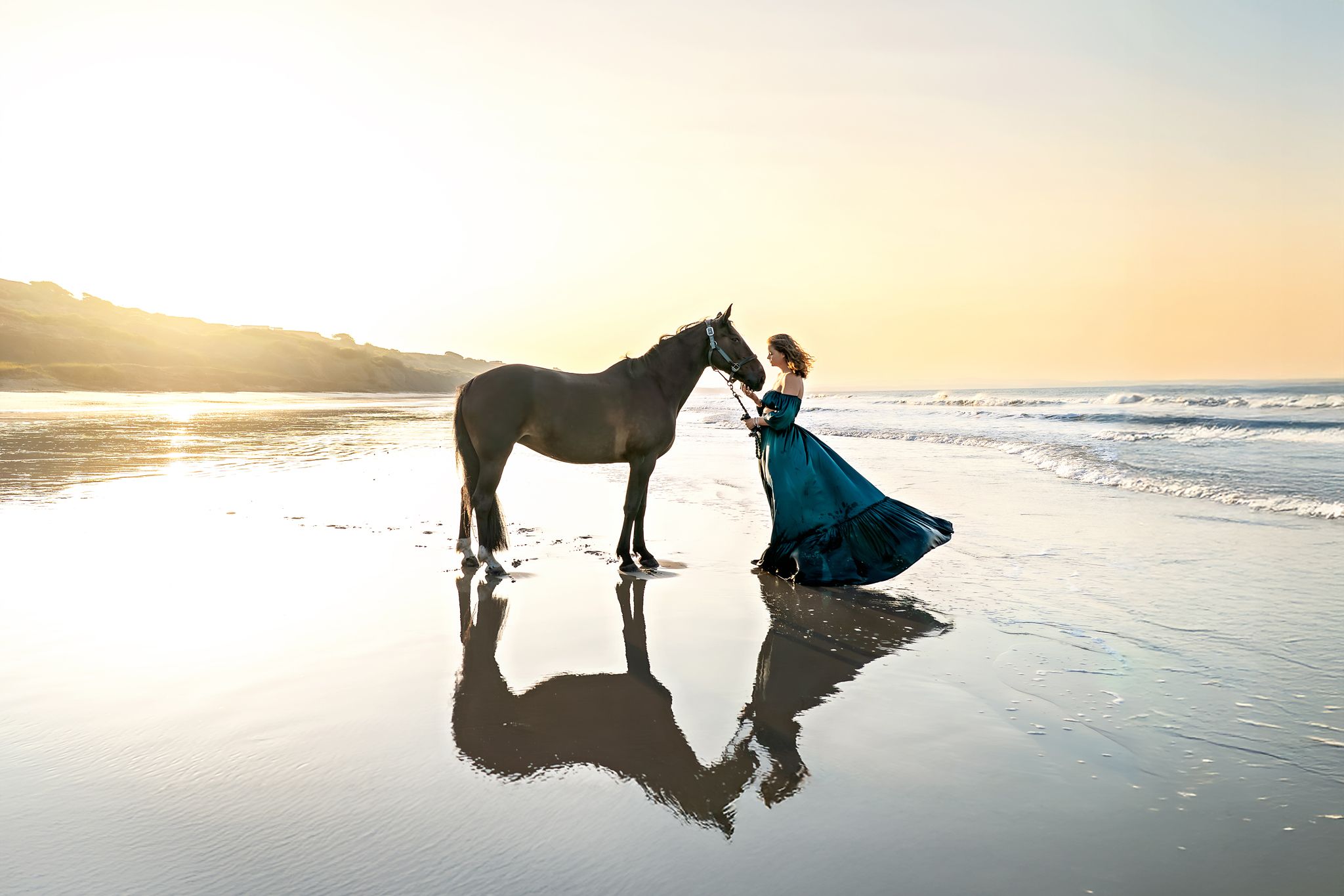 Woman and horse, photo session at sunrise at the beach in Highcliffe, New Forest.