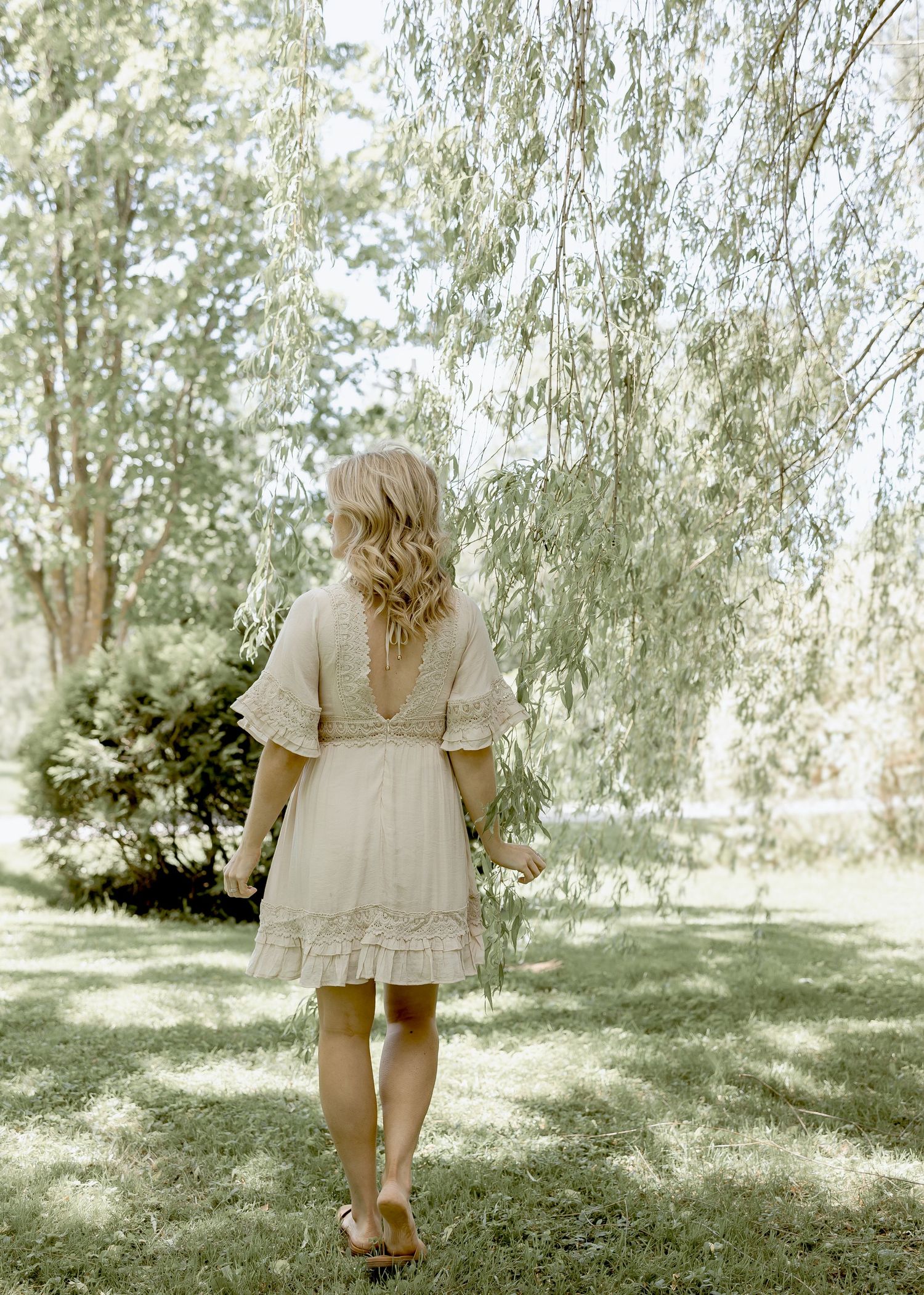 Morgan is walking the property. Willow branches swaying. Beautiful sunny summer day