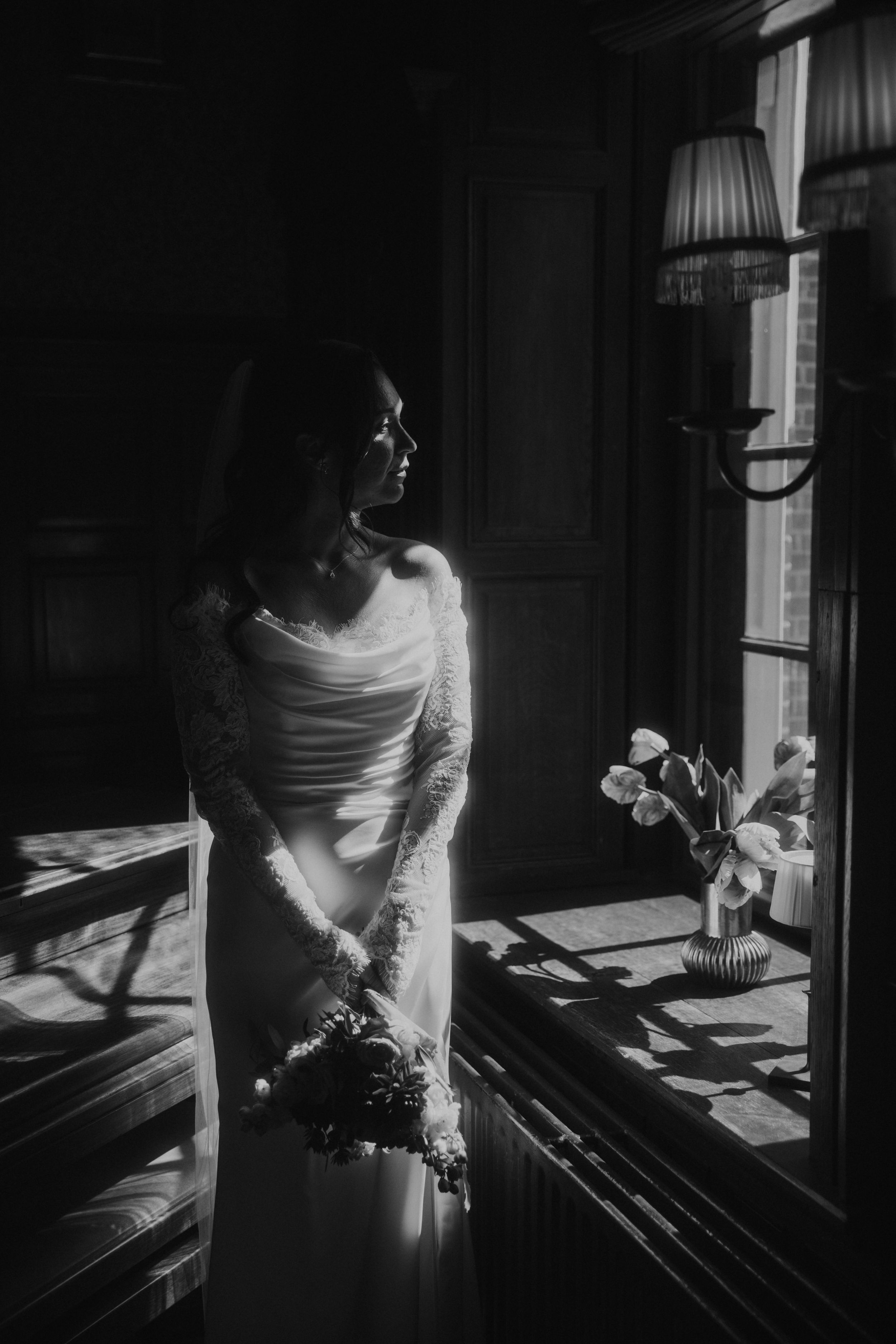 A series of black and white photographs showing a person in white clothing playing piano in dramatic lighting.
