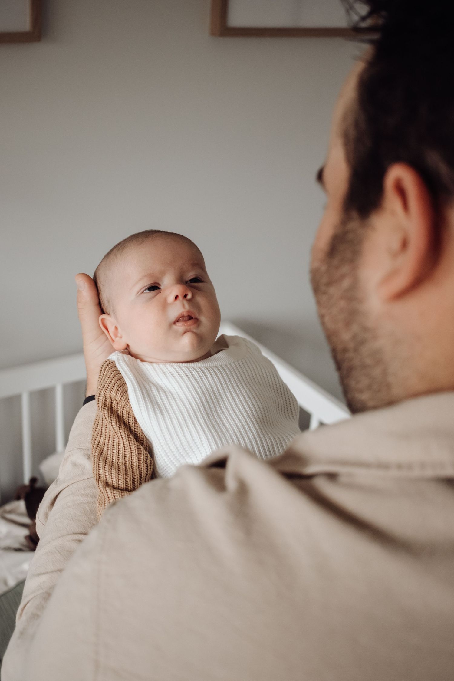 Dad holding his son.