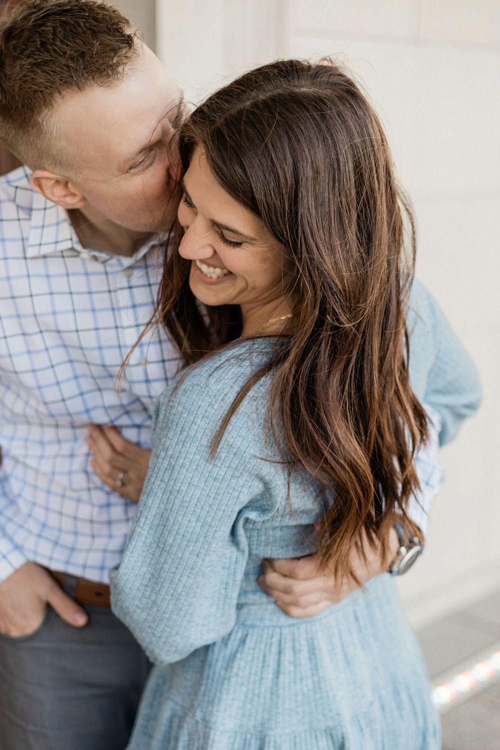 A sweet candid moment between a couple during their engagement photo session.