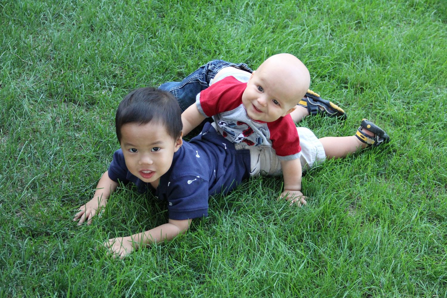 two children wrestling happily