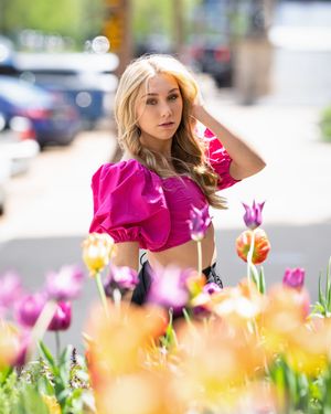 Colorful tulips bloom in a garden with soft bokeh background creating a dreamy spring atmosphere.