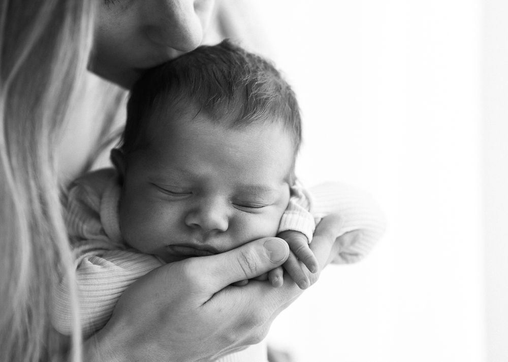 mother holding newborn baby calm natural connection Halifax studio