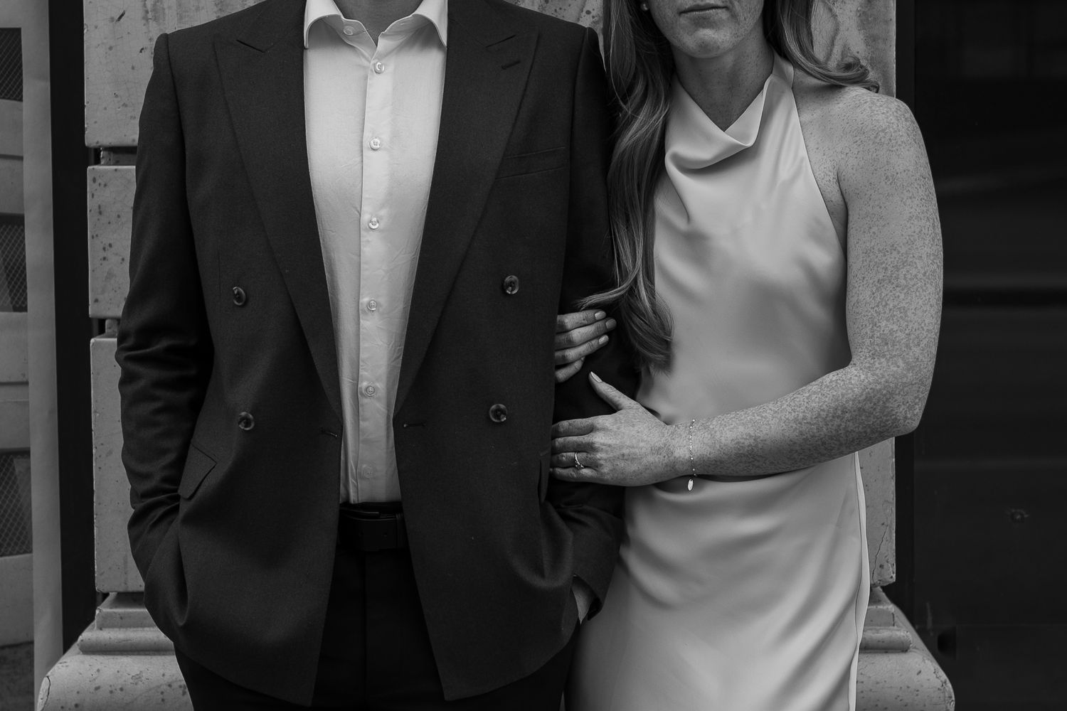 Elegant black and white portrait of couple in formal attire.