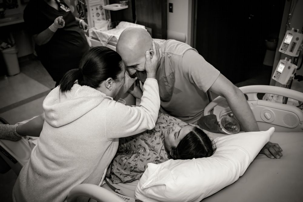 Medical staff providing support during a hospital procedure.