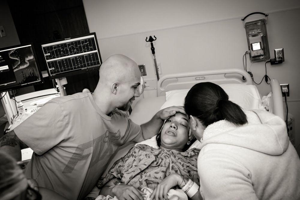 Healthcare team providing medical care in a hospital setting.