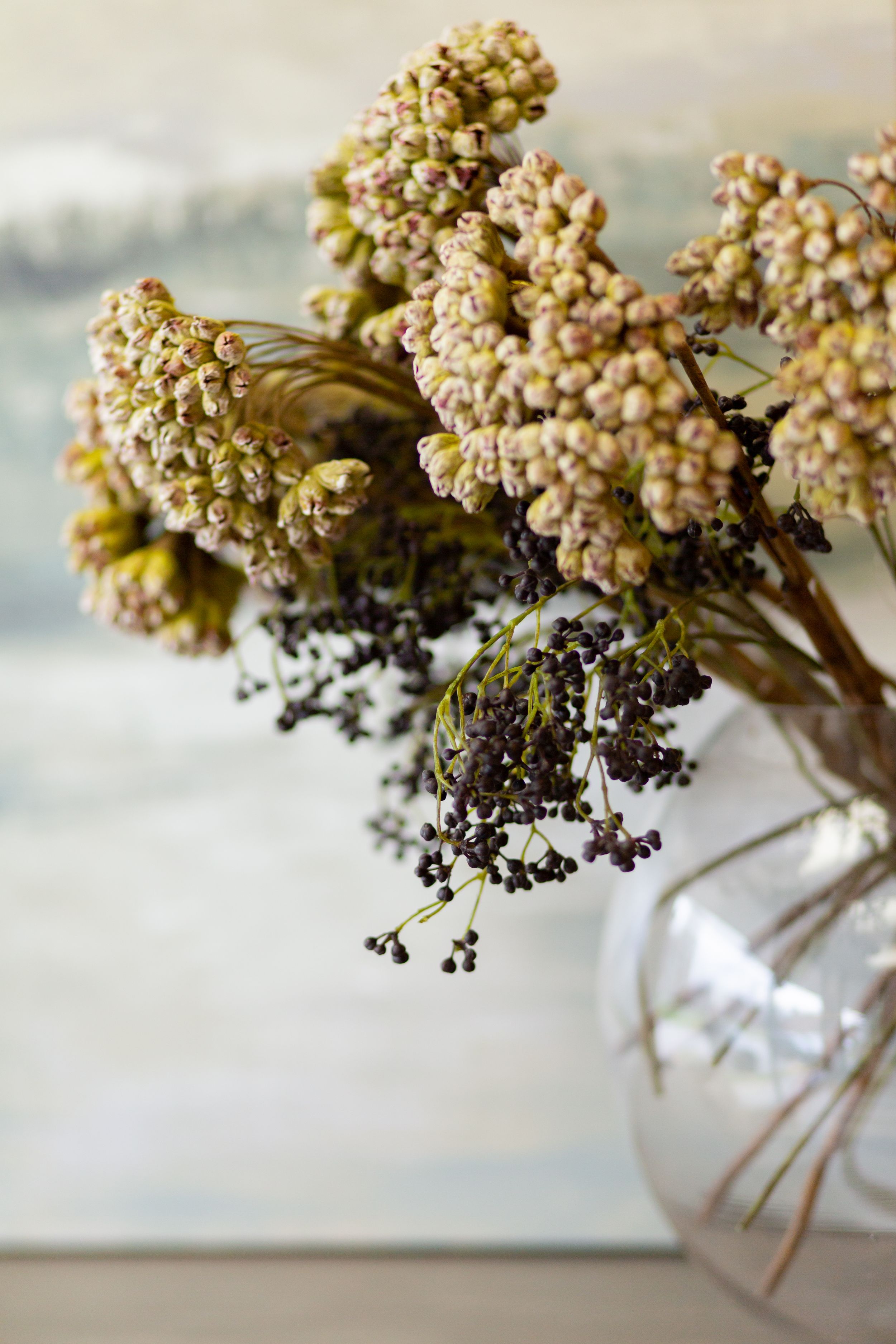 Dried flowers and seed pods arranged in clear glass vase create a delicate vintage display.
Commercial Photography
