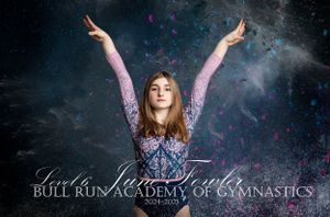 Gymnast in purple leotard with arms raised poses against dark background with sparkles at Bull Run Academy of Gymnastics.