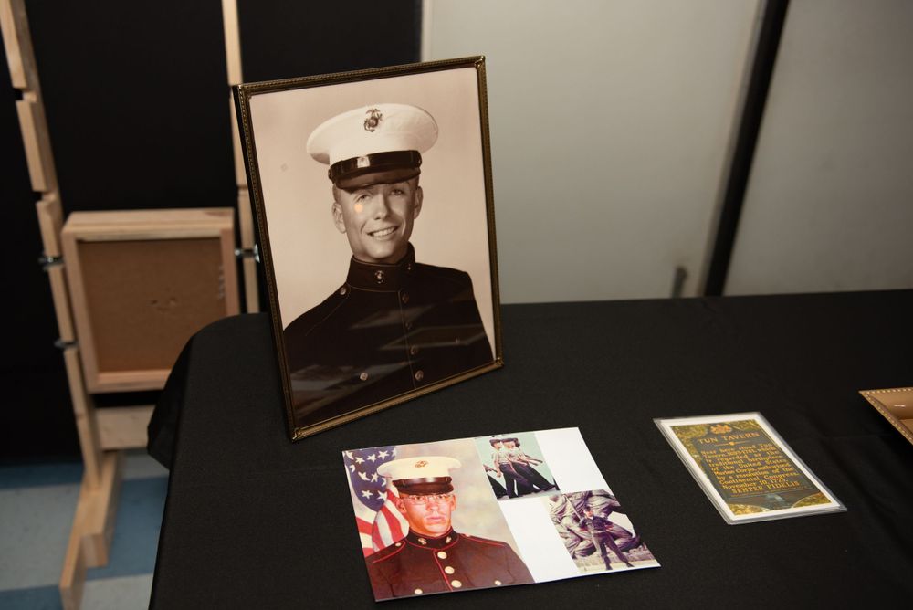 Military portraits and photographs displayed on a dark background.