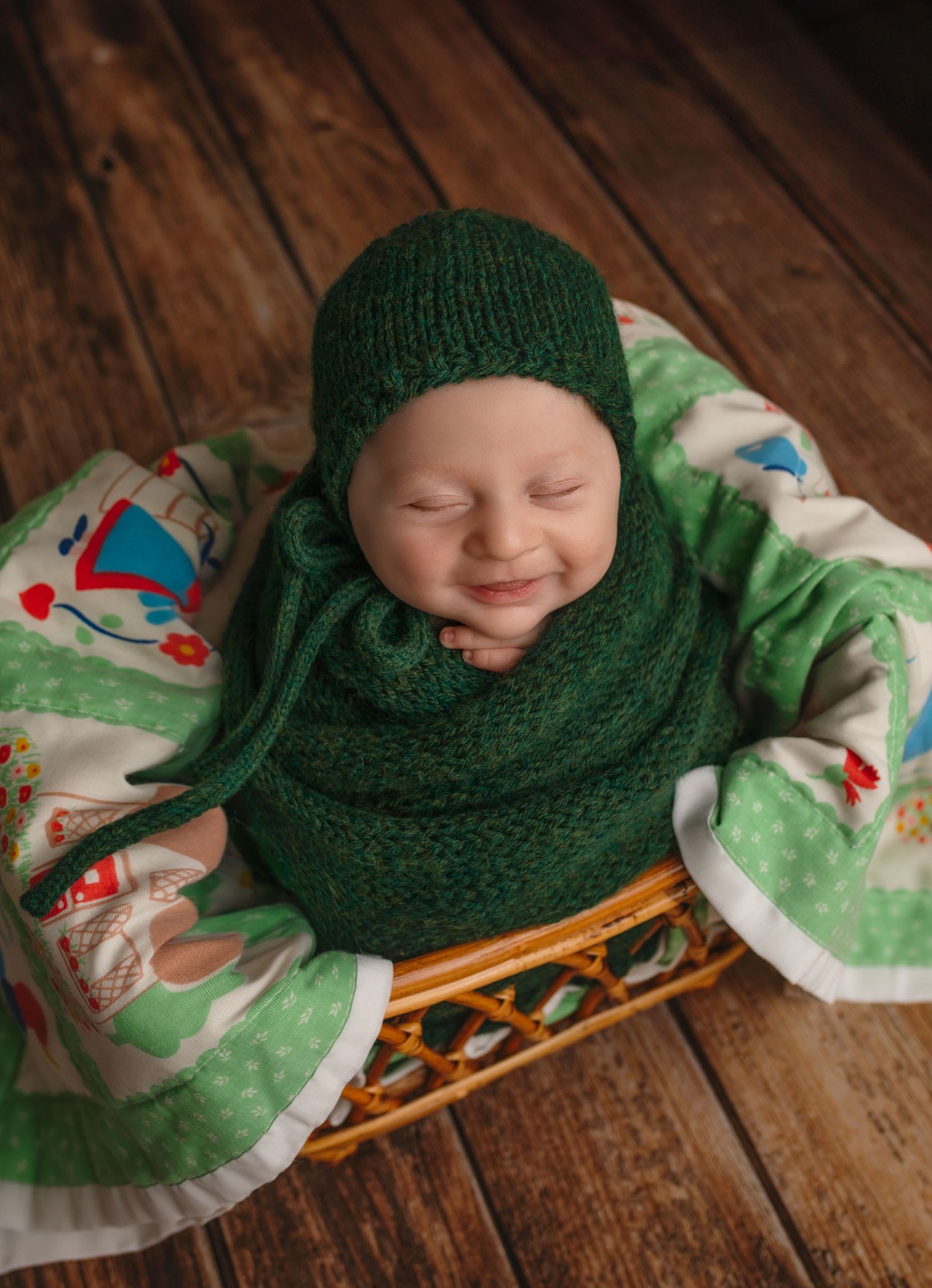 Charlottesville photographer, newborn, family, maternity, baby, baby boy upright in green wrap with green quilt