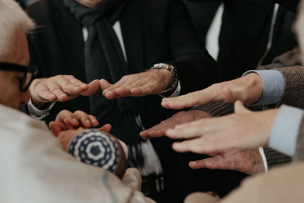 Business people reaching out their hands in a collaborative gesture during a team meeting.